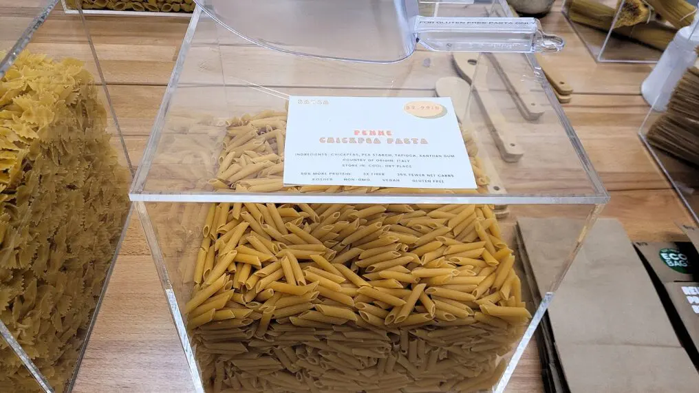 Bulk penne pasta in clear container