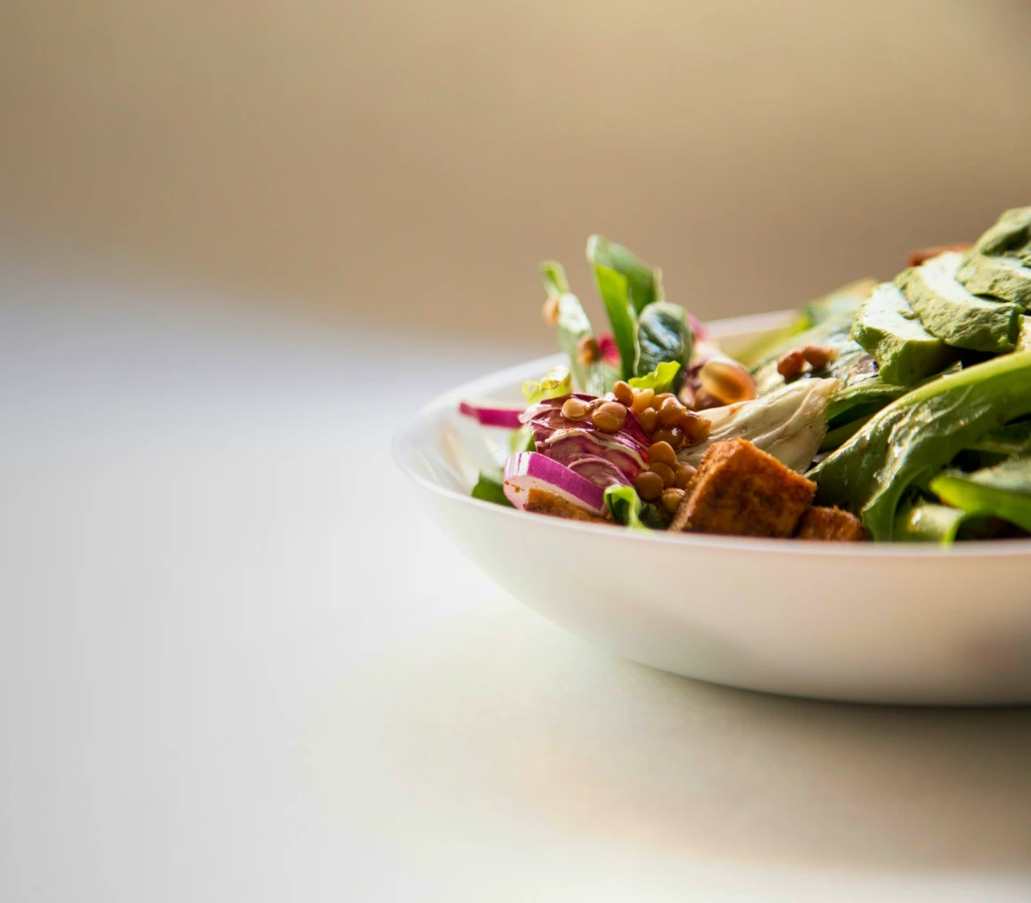 Healthy salad bowl with avocado and lentils